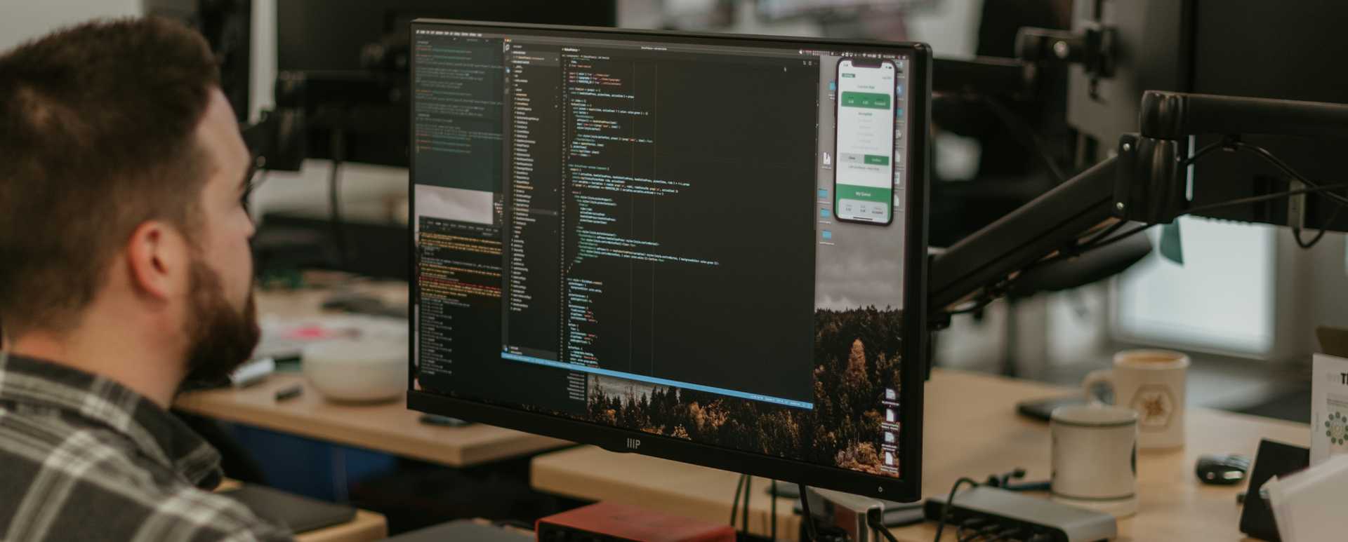 Developer staring into the depths of a merge conflict.